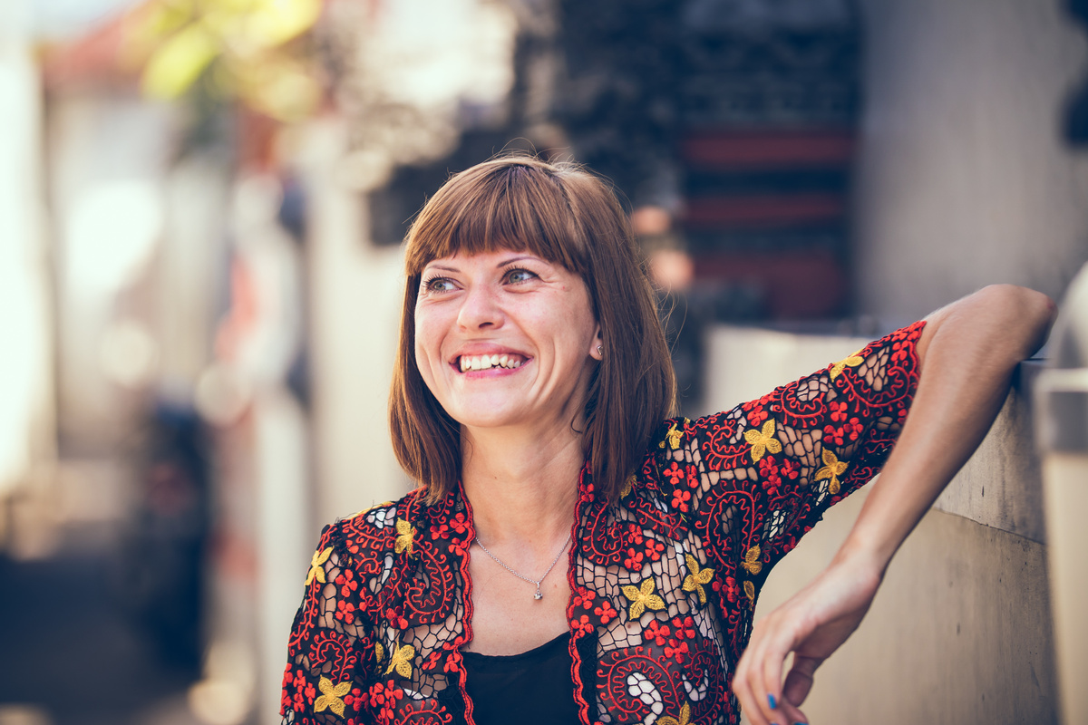 Smiling Woman Wearing Red Top